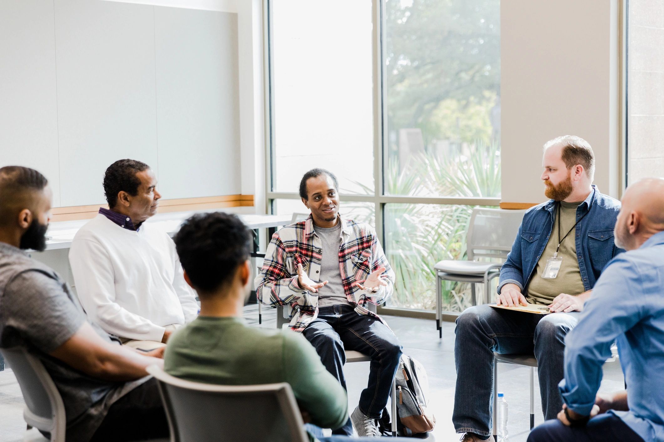 Resident speaking during a recovery support group meeting